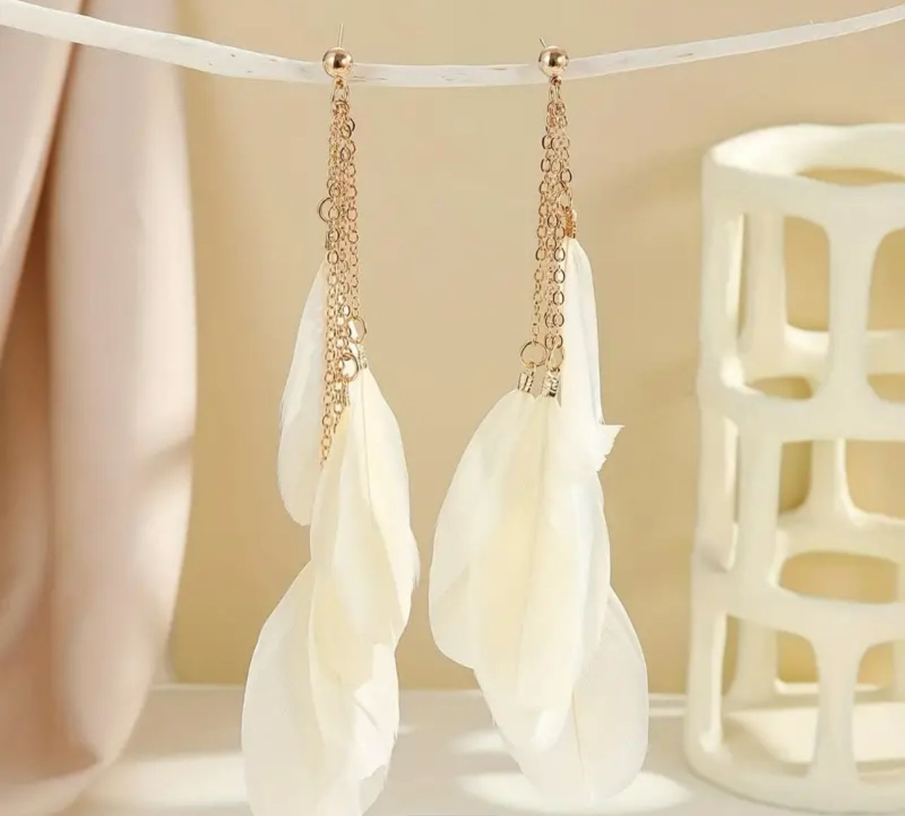 White feathered earrings