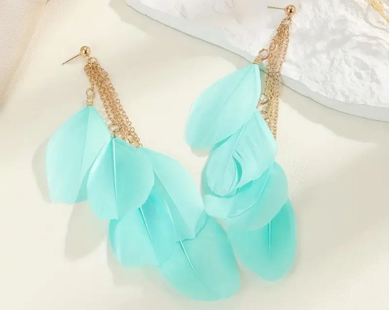 Blue feathered earrings